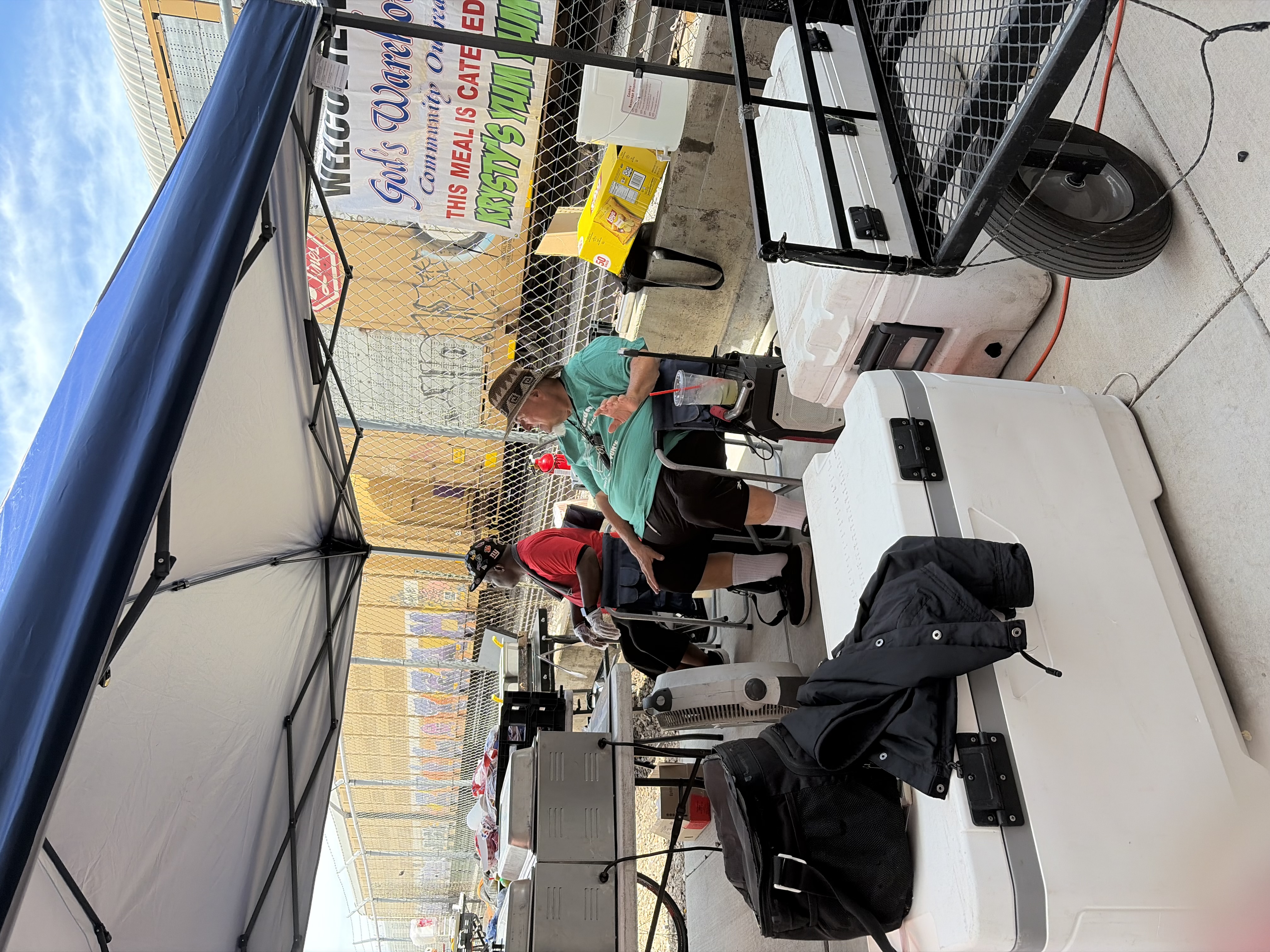 The man with the microphone, announcing the menu aloud.